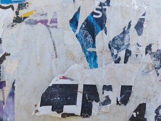 Fototapeta premium Torn and ripped street poster background, abstract and messy old paper art collage