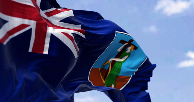 Close-up of Montserrat flag waving in the wind on a clear day - Powered by Adobe