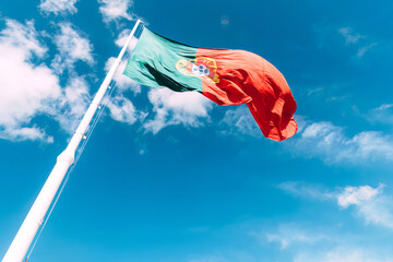 Majestic Portugal Flag Waving High Against a Clear Blue Sky