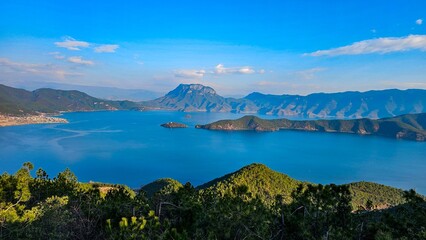 Valley with a Lugu Lake and distant mountains in China