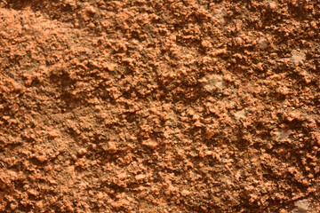 The red rough texture of a rock