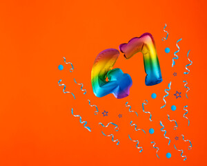 Multicolor balloon number 47 - Confetti explosion on orange background. Birthday card - obrazy, fototapety, plakaty