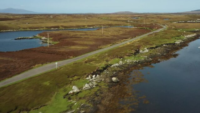 North Uist, Outer Hebrides, Scotland. Video aerial pano North to East over scattered islands of tidal Loch Maddy from Loch an Duin toward Lochportain