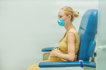 pregnant woman undergoes a blood test, a pivotal step in ensuring the well-being of both herself...
