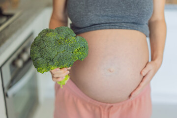 Embracing a nutrient-rich choice, a pregnant woman eagerly prepares to enjoy a wholesome serving of...