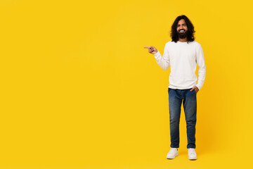 Man With Long Hair Standing in Front of Yellow Background