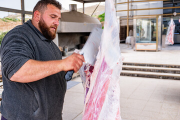 butchery selling fresh meat from hanging lamb outdoor