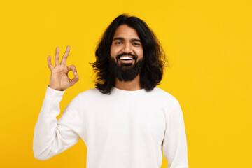 Smiling Man With Long Hair Giving OK Sign