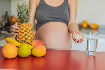 Balancing choices for optimal nutrition, a pregnant woman decides between the wholesome goodness of fresh fruits and the convenience of vitamin tablets, ensuring a well-rounded approach to her