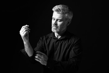 Portrait of handsome man on dark background. Black and white effect