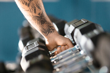 Man With Tattoo Holding Barbell, Cropped shot