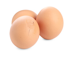 Whole and cracked chicken eggs isolated on white