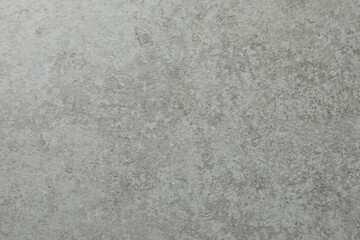 Grey concrete textured surface as background, closeup