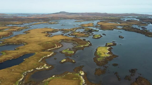 North Uist, Outer Hebrides, Scotland. Video aerial pano East to South over scattered islands of tidal Loch Maddy from Loch an Duin