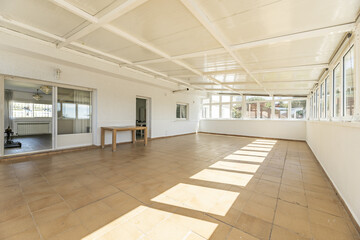 A closed terrace with metal roofs and the entire perimeter with glass windows