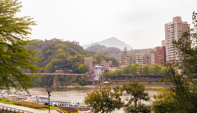 Calm nature landscape of buildings near a river
