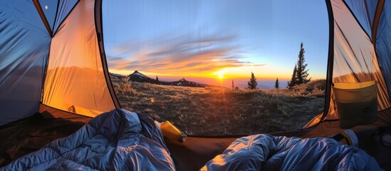 View of the sunrise on the mountain in the morning from inside the tent