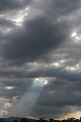 White grey cloudy day after rain with little bit ray of sun shining through the clouds, Sky nature background.