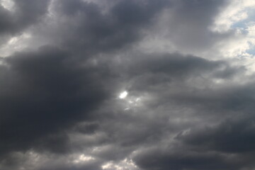 White grey cloudy day after rain with little bit ray of sun shining through the clouds, Sky nature...