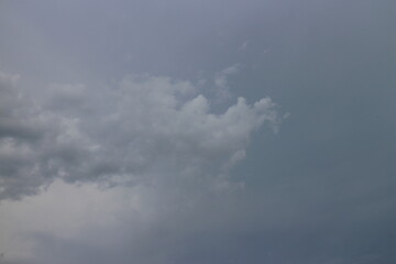 Storm clouds in the sky over the city. Gray gloomy sky before hurricane