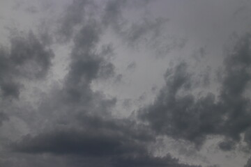 cloudy sky with rare dark gray clouds with threat of rain