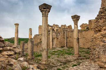 Remnants of stone columns of Temple of Minerva rising at ruins of ancient Roman settlement of...