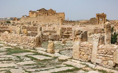 Ruins of ancient Roman settlement of Sufetula in Sbeitla, Northern Central Tunisia, with remnants of stone walls and columns from residential and administrative buildings and temples on spring day