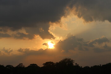 Sunset sky clouds in the Evening with Golden orange sunlight in golden hour, Dusk sky background.