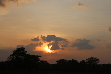 Beautiful colorful dramatic sky with clouds at sunset or sunrise.