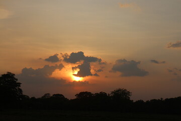 Beautiful colorful dramatic sky with clouds at sunset or sunrise.
