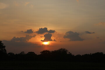 Beautiful colorful dramatic sky with clouds at sunset or sunrise.