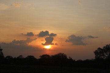 Beautiful colorful dramatic sky with clouds at sunset or sunrise.