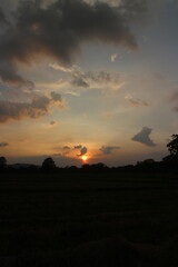 Beautiful colorful dramatic sky with clouds at sunset or sunrise.