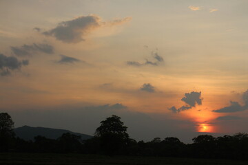 The sky ablaze with hues of orange and pink as the sun gently sank below the horizon making the end of another beautiful day.