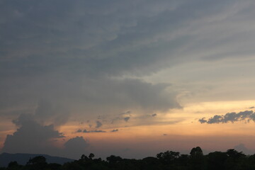 Beautiful Vivid sky painted by the sun leaving bright golden shades. Image of cloud sky on evening time. Evening Vivid sky with clouds.
