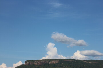 Blue sky and beautiful cloud with meadow trees. Plain landscape background for summer poster. The best view for holiday.