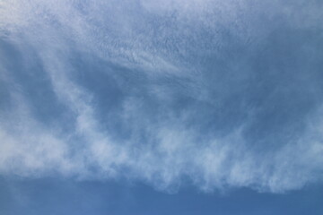 blue sky background with tiny clouds