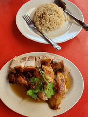 popular street food. Ipoh Hor Fun Soup and Roasted Chicken Drumstick and Roasted Pork Belly with Oily Rice, usually eaten as lunch or dinner