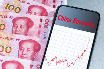 Economy China financial growth rising. yuan banknotes and chart growth economy China