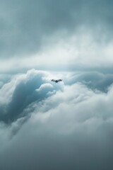 Fototapeta premium A MALE drone disappearing into a thick layer of clouds, symbolizing the unseen eye in the sky