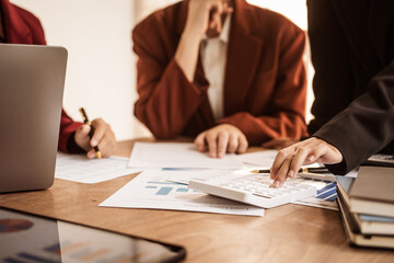 Analyzing startup group meetings to offer advice and make decisions. We assess discussions, offer insights, and assist in reaching conclusions for better business outcomes, hands close up at desk.