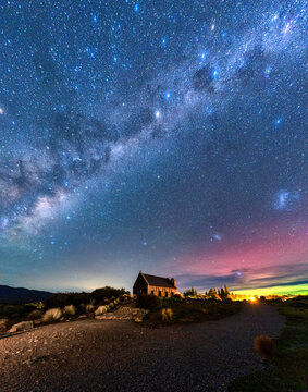 Milky Way, Nebula, Aurora Australis glowing over Church of the Good Shepherd at Lake Tekapo, New Zealand