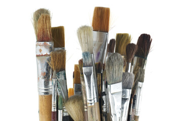 Array of paintbrushes of different sizes and colors over white - Powered by Adobe