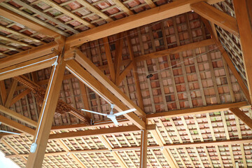 The roof of a simple building, the frame is made of wood. Roof tiles are made from clay