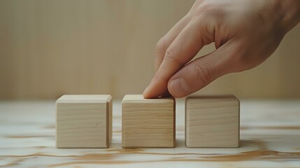 Elegant Contemplation: Hand and Wooden Blocks
