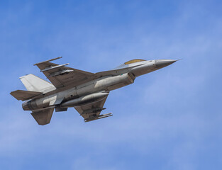 Fighter jet Military aircraft flying with high speed on blue sky
