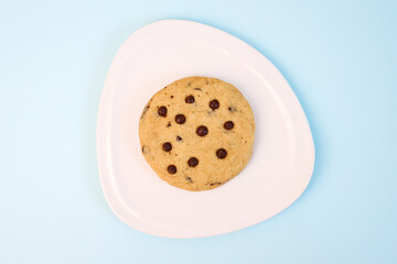 Vanilla Choco Chips Cookies on Plate Isolated on Blue Background 
