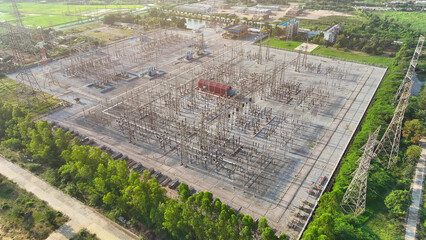 An electrical substation, captured from above by a drone, stands as a technological fortress amidst...