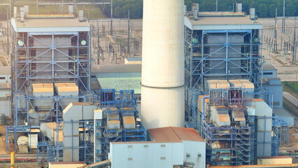 A thermal power plant generates electricity by burning fossil fuels like coal. Heat from combustion...