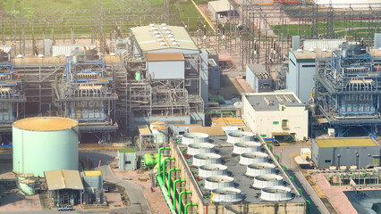 From the bird's-eye perspective, the power plant stands as a testament to human ingenuity, a...